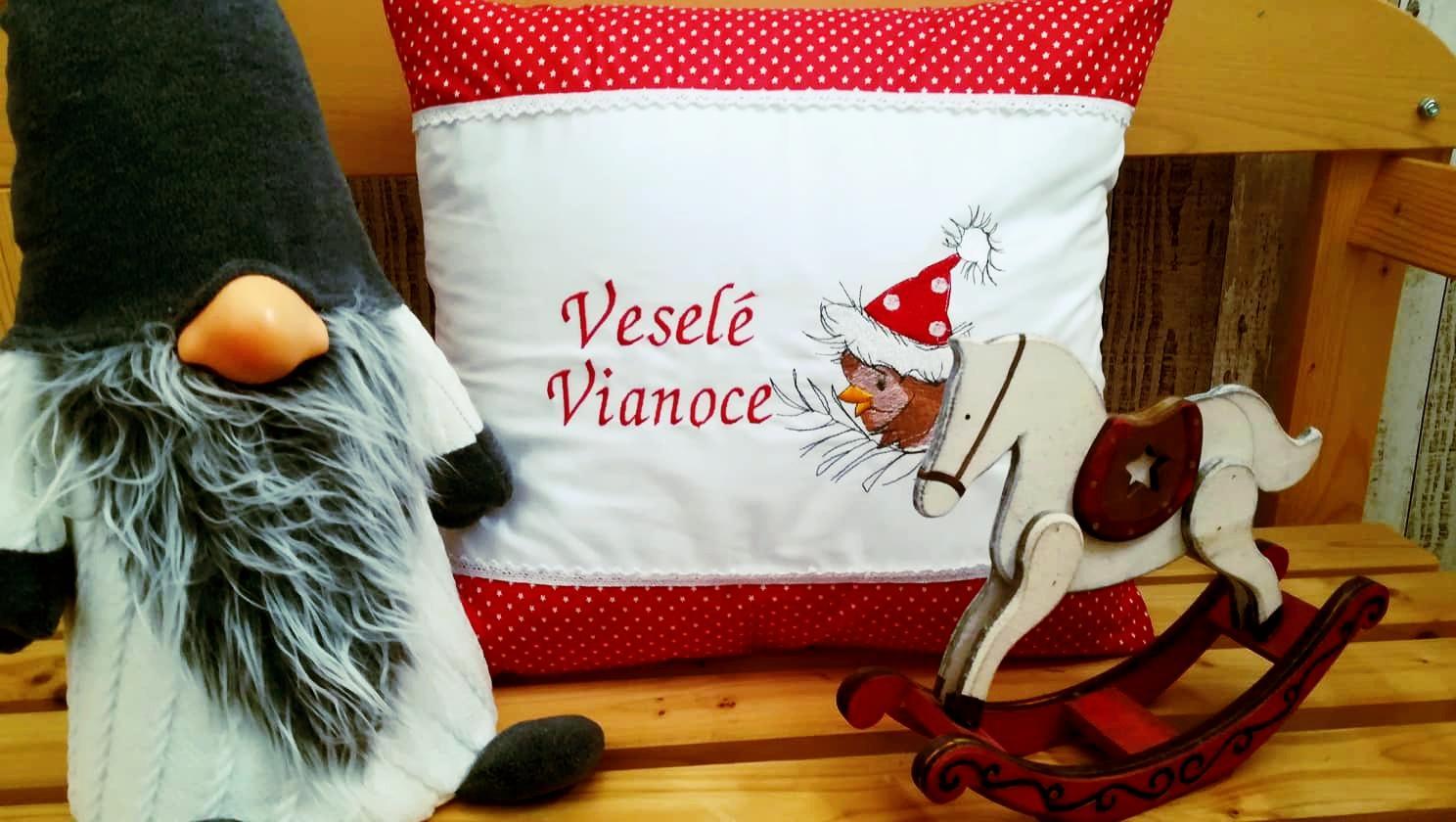 Embroidered cushion with Christmas bird design