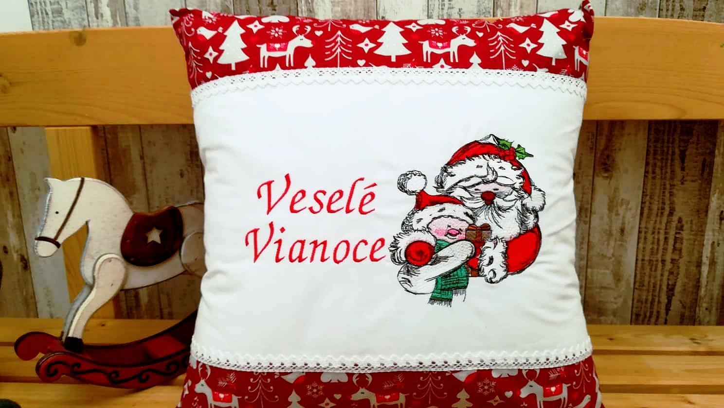 Embroidered cushion with Santa and snowman design