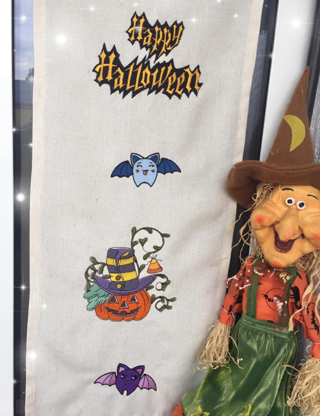 Embroidered curtain with Halloween design