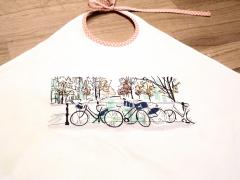 Fragment of embroidered bib with Bicycles design