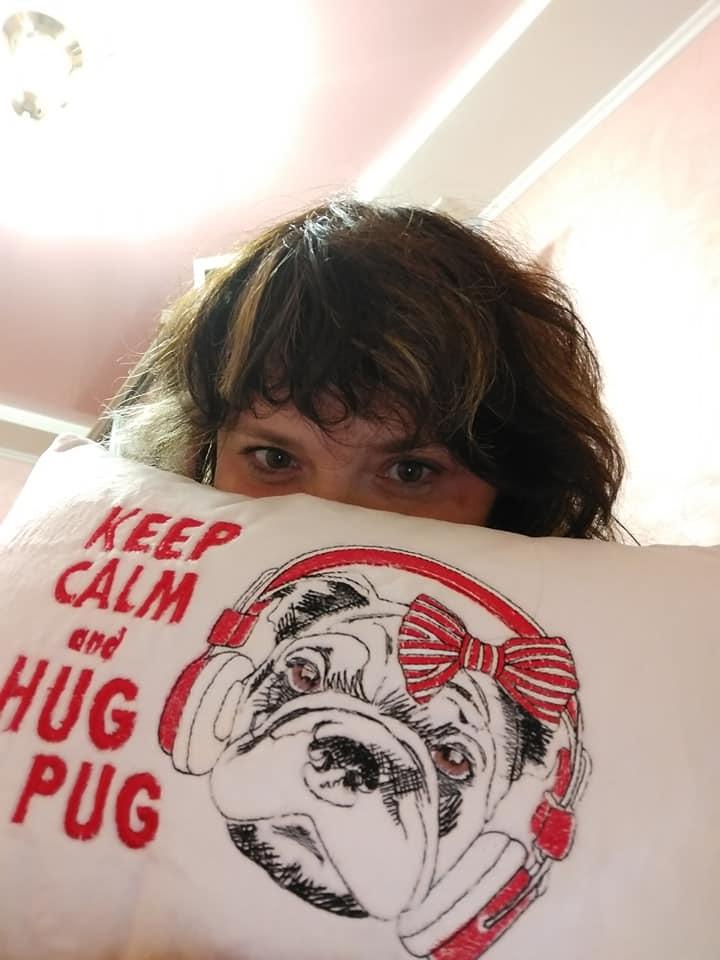 Embroidered cushion with Pug dog design