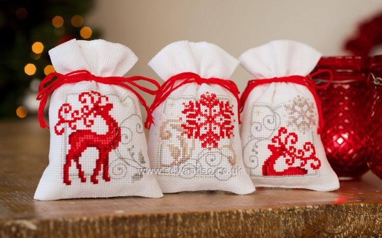 Three embroidered gift bags with Christmas free designs