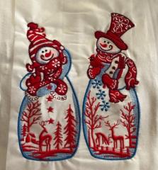 Two embroidered snowmen made in the original style