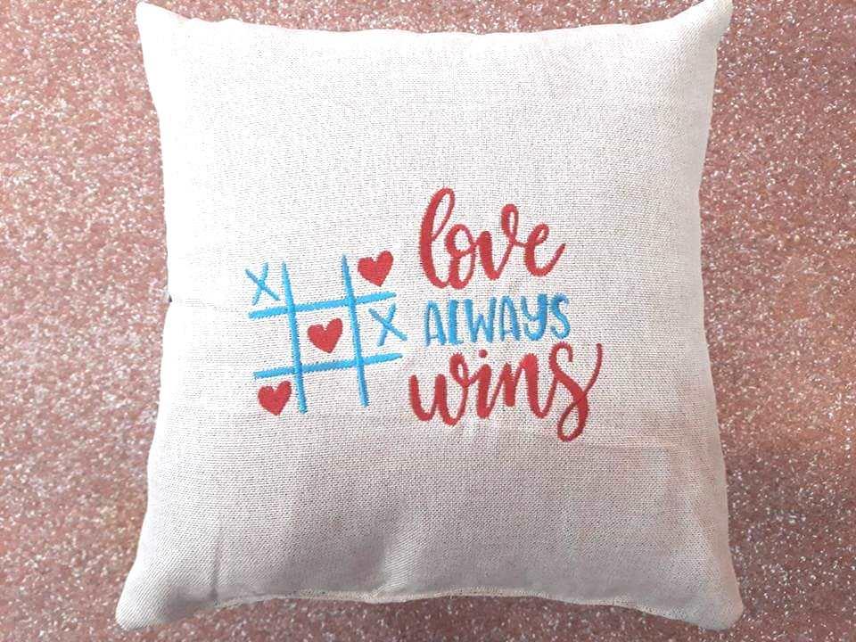 Embroidered cushion with Love always wins free design