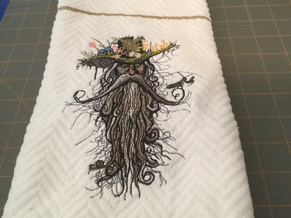 Embroidered towel with Rootman design