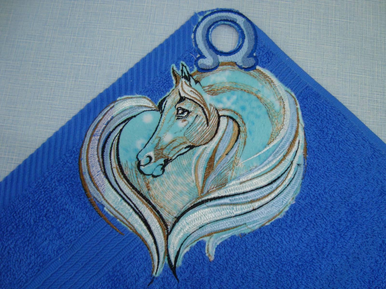 Towel with a sad horse machine embroidery design