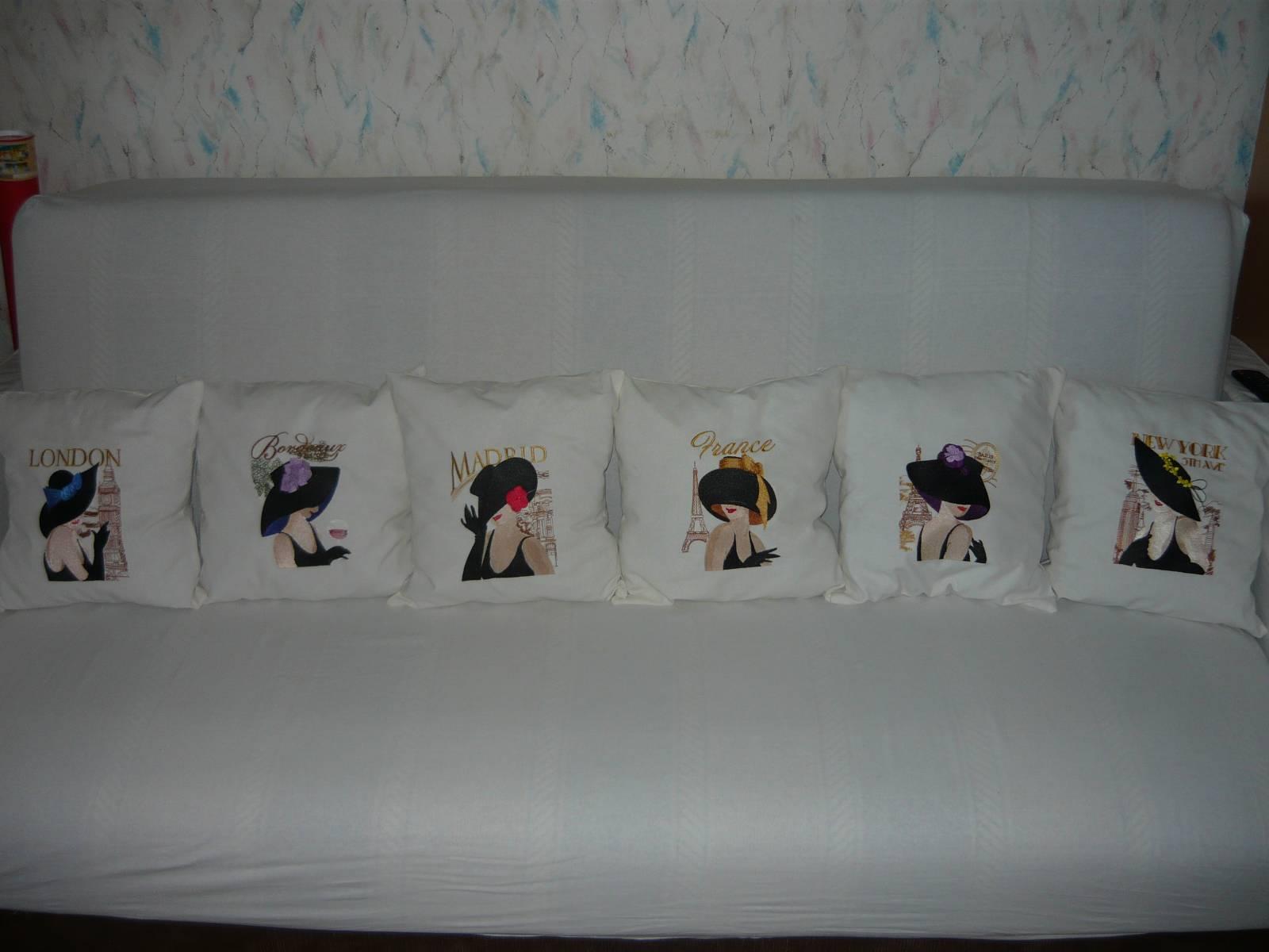 White pillows with ladies from different capitals: all together