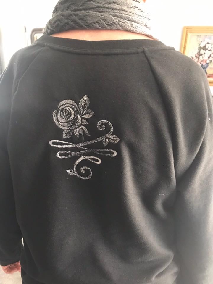 Embroidered sweater with rose design