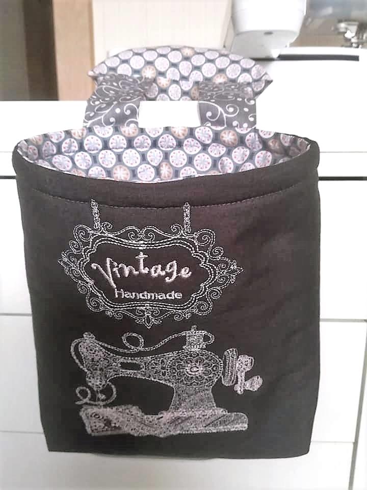 Embroidered textile basket with Sewing machine design