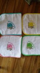 Se of embroidered bibs with snail design