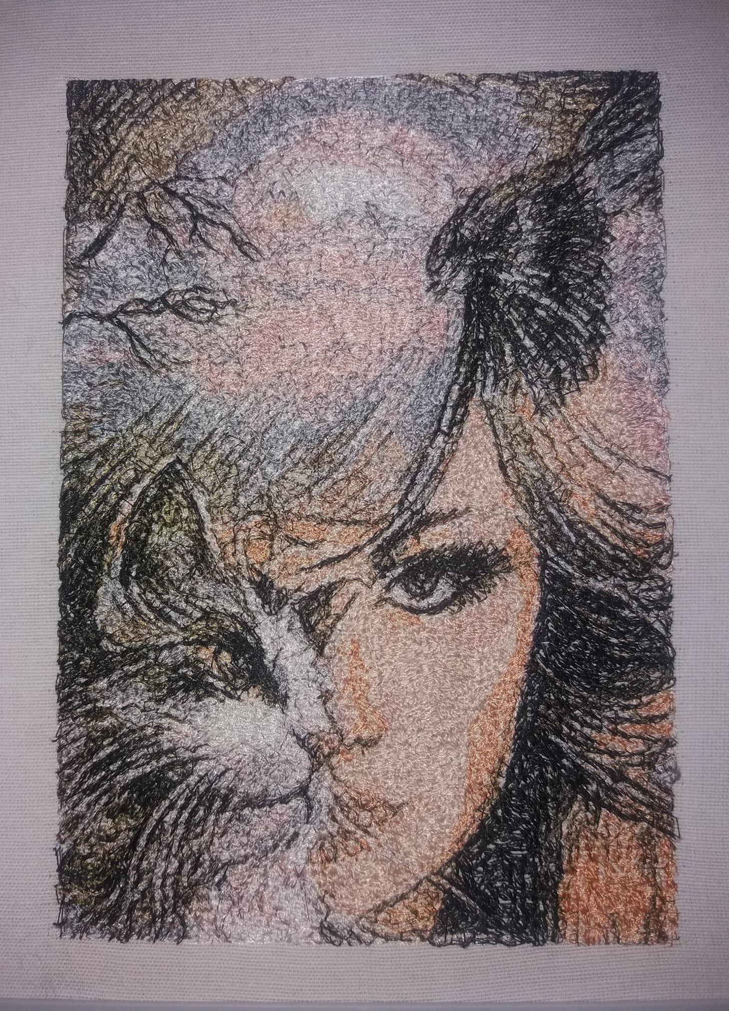 Embroidered picture with Woman and cat design