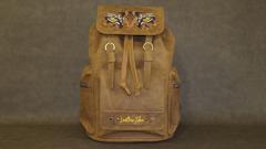 Wild Side: Stunning Tiger Eyes Embroidery design on Leather Backpacks