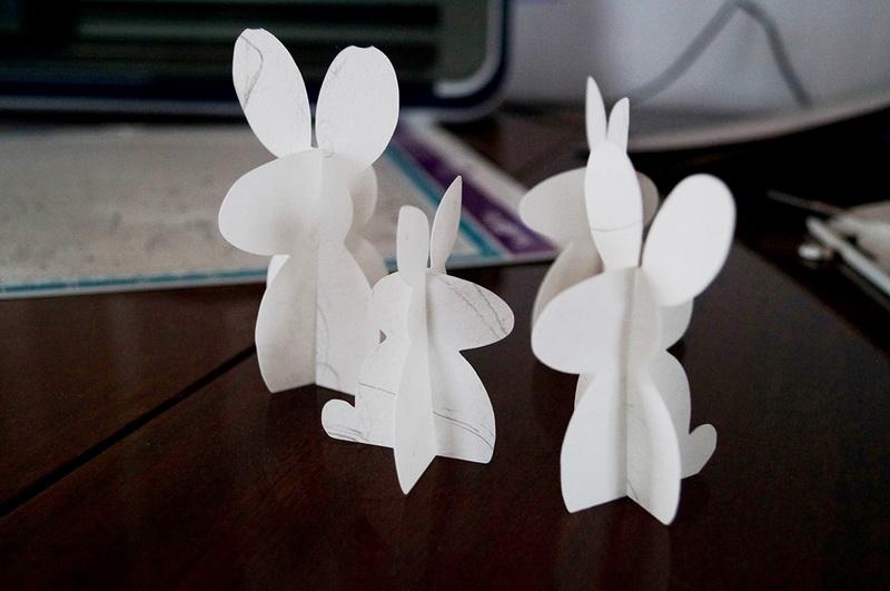 Easter bunnies ready Paper Easter bunnies standing on table