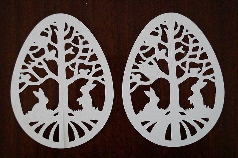 Cutting out the Easter egg Two paper easter egg cuttings