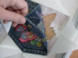 Butterfly embroidery on jeans pocket