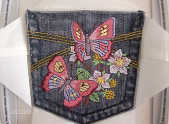 Jeans pocket embroidered with butterflies