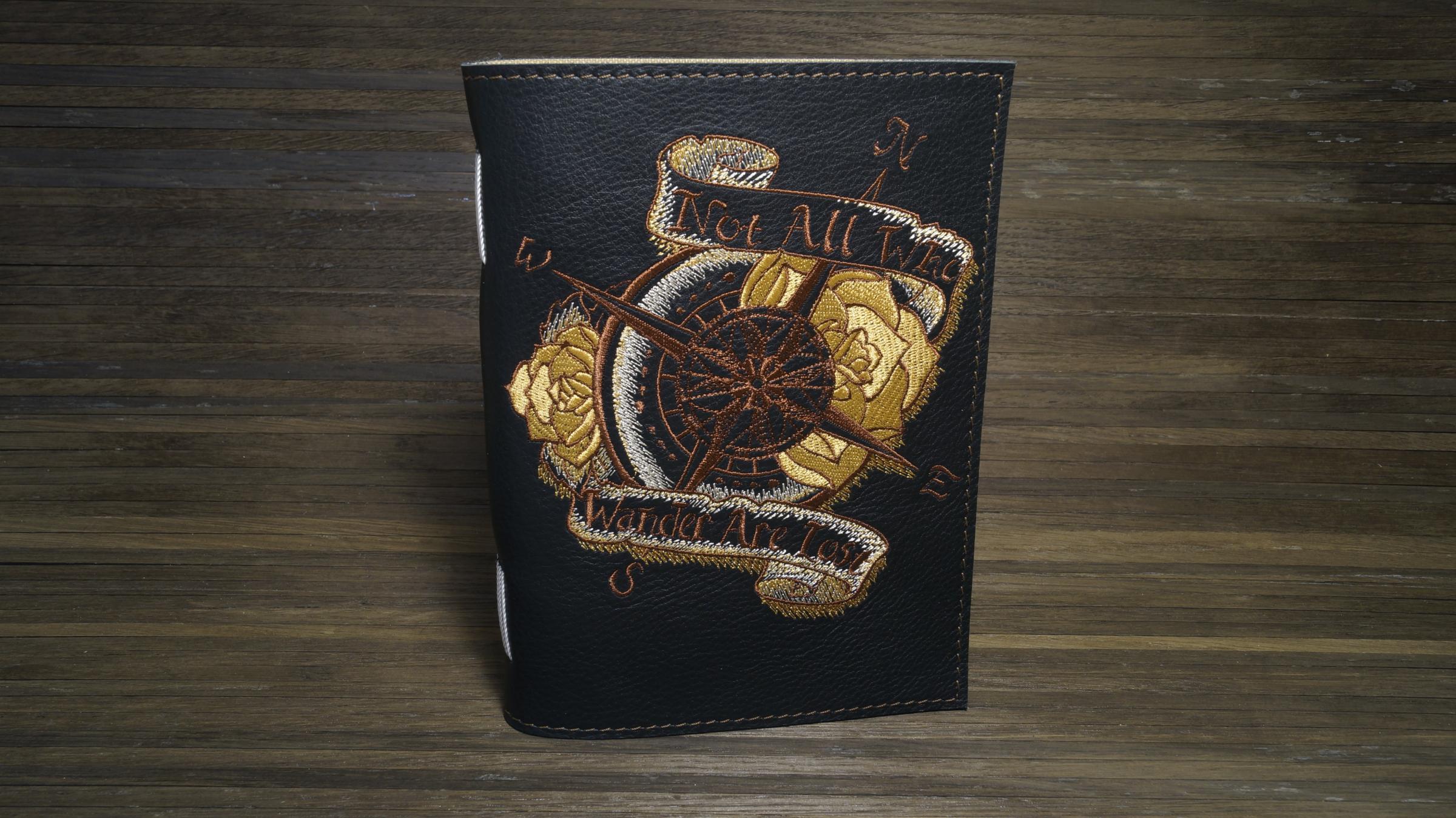 Embroidered leather cover with Rose of winds design