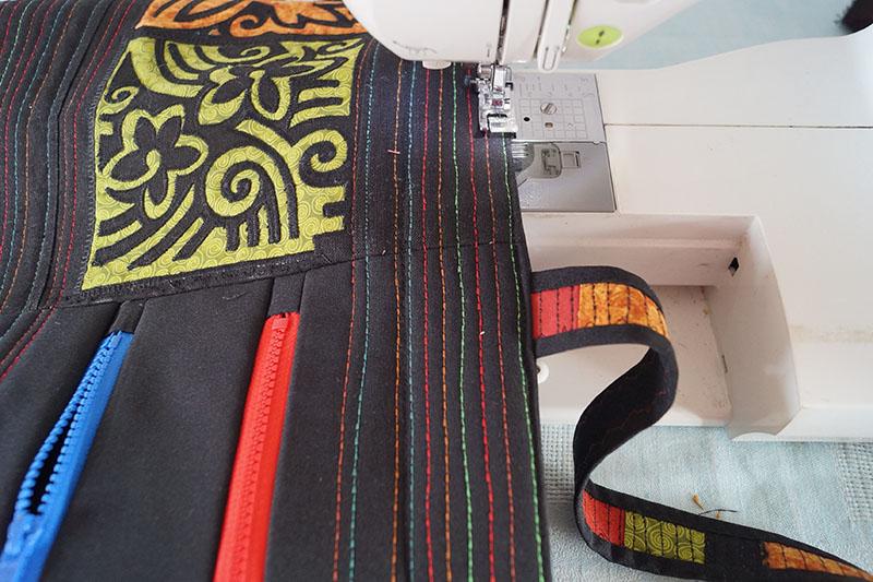 Adding handles Hawaiian bag with red and blue zippers and handle