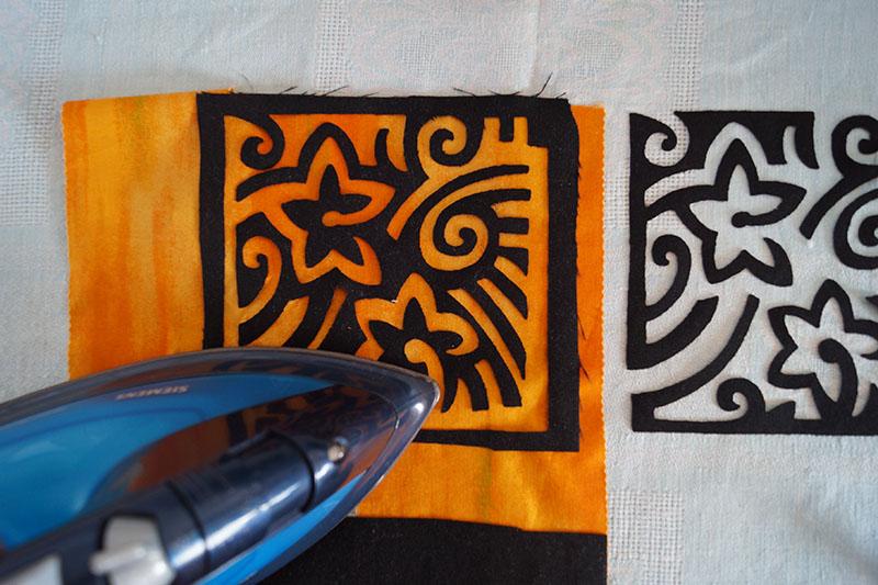 Attaching applique to fabric with an iron Yellow applique with iron