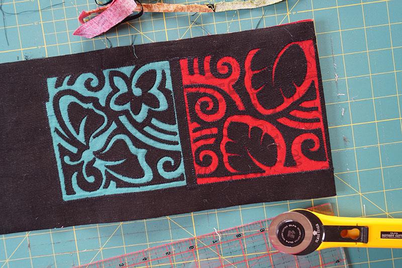 Trimming the edges Blue and red applique