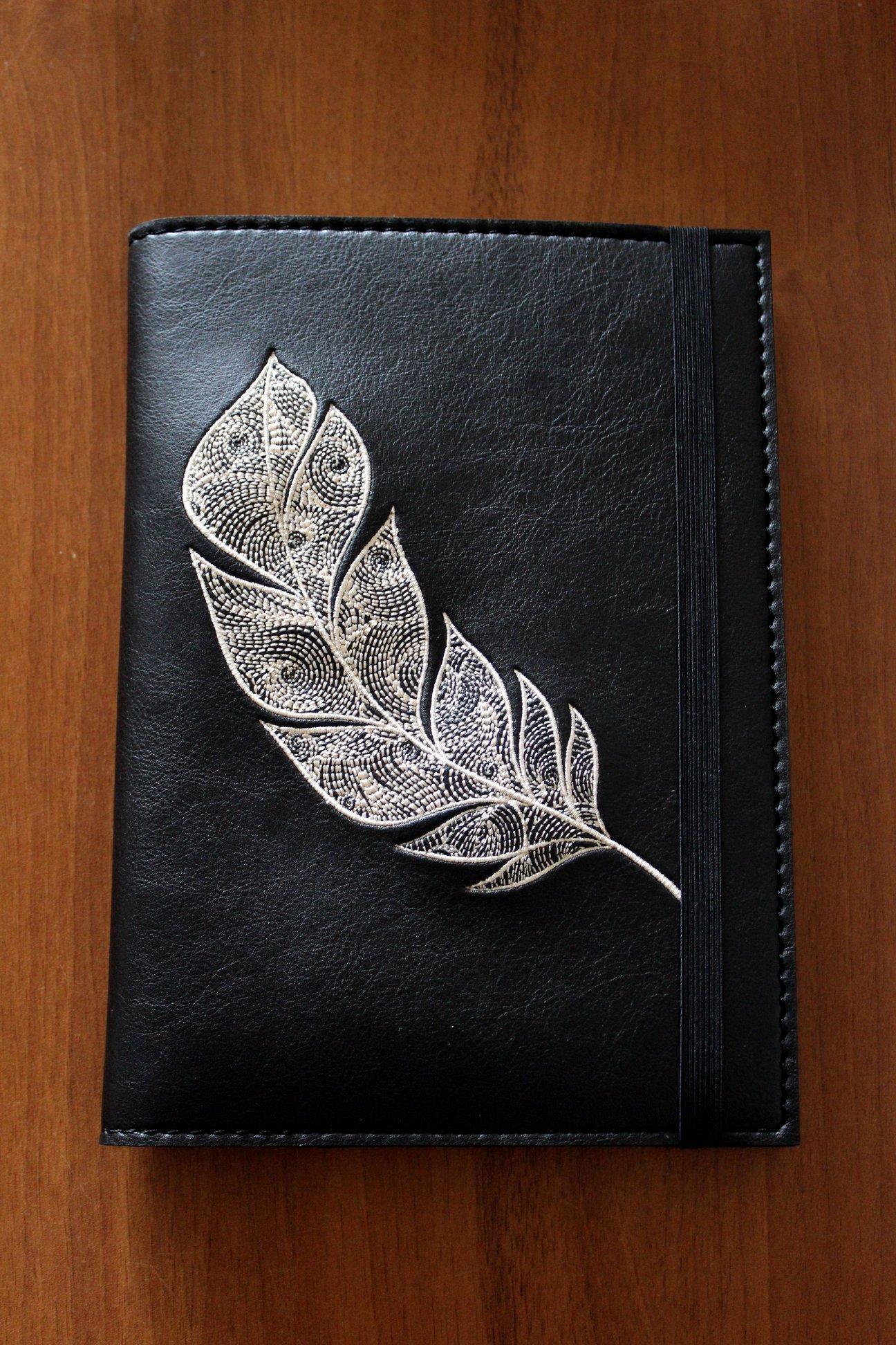 Embroidered cover with Feather design