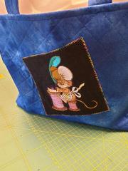 Discover the Charm of an Embroidered Bag with Writing Mouse Design
