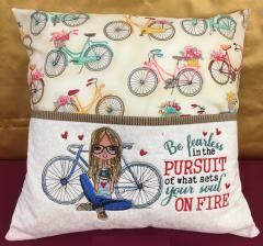 Embroidered cushion with Young photographer design