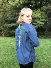 Embroidered jeans jacket with Root man design