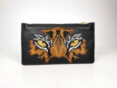 Discover the Thrilling Tiger Eyes Embroidery Design for Your Handbag