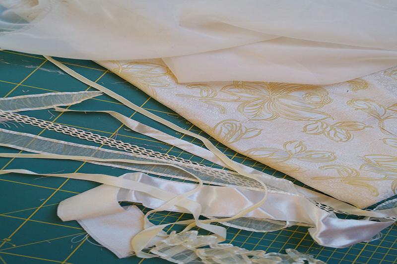 Preparing the materials White fabric and ribbons
