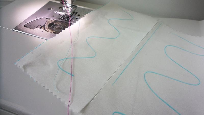 Drawing two wavy lines on your fabric Wavy blue lines on white fabric