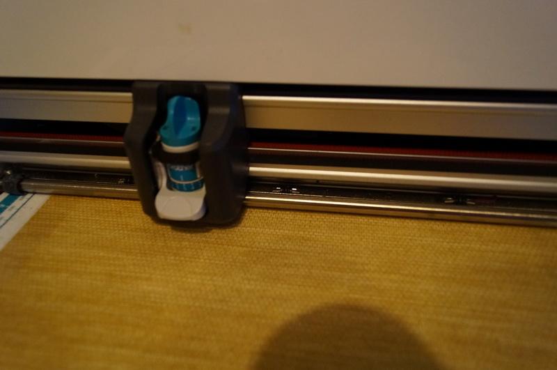 Shade secured with adhesive tape Roller shade secured