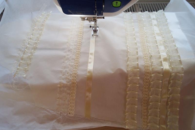Stitching pleated ribbons to sleeves Sewing white ruffles to sleeves