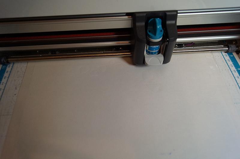 Sheet of paper on cutting mat Piece of paper on ScanNCut mat