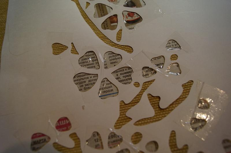Flowers taped over Paper stencil secured with adhesive tape