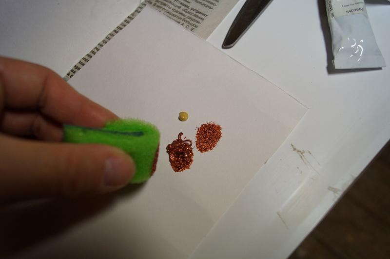 Squeezing paint onto paper Acrylic fabric paint on paper