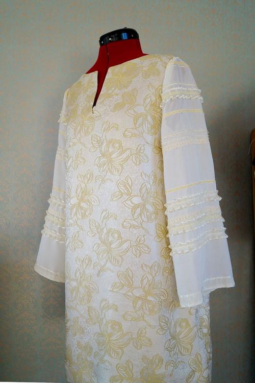 Old dress with new decorated sleeves White dress with ruffled ribbons