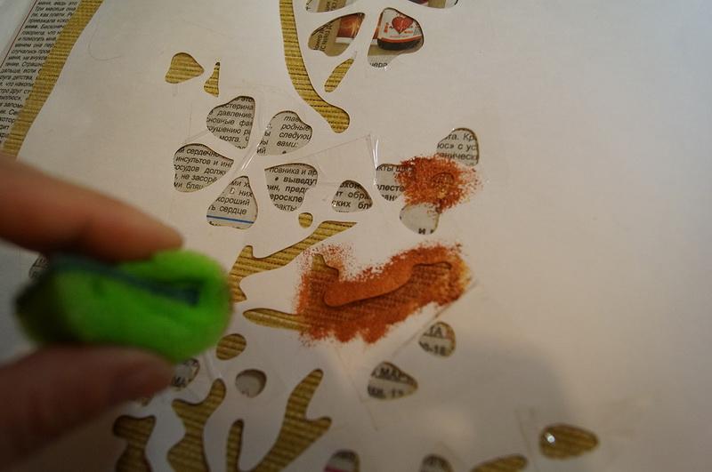 Dabbing shade and stencil with paint Painting sponge and stencil