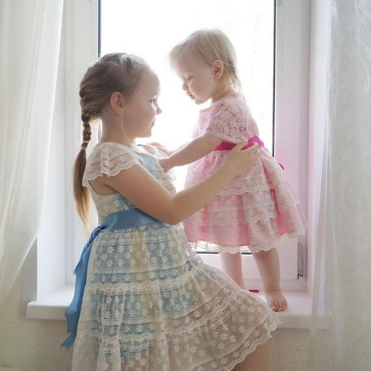 Girls in lacy dresses