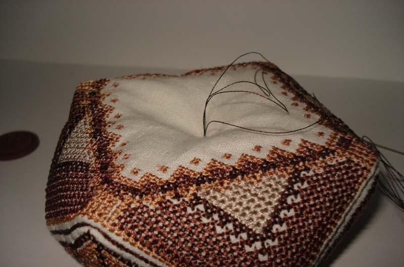 Pulling thread through biscornu Double thread loop