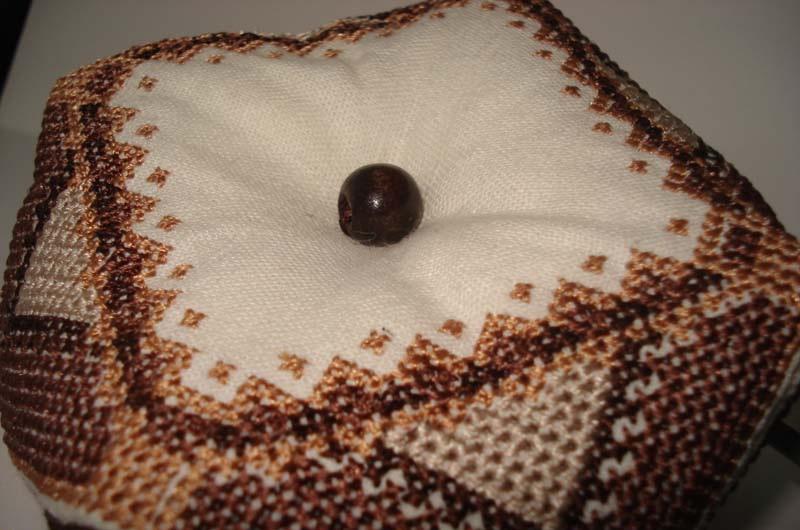 Biscornu decorated with a bead Biscornu with a bead