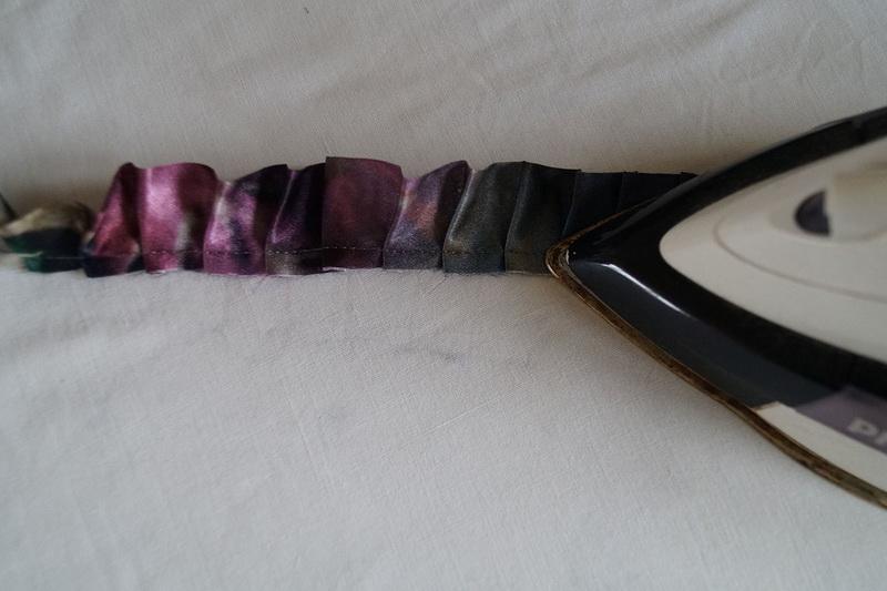 Flattening pleats with an iron Ironing out ruffles