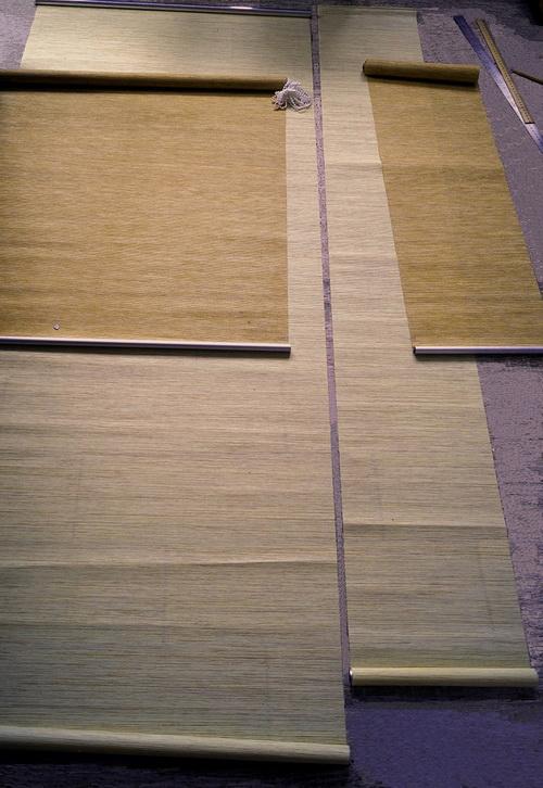 Cutting material for future roller shades Two roller shades prepared for cutting