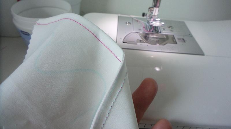 Double stitched seam two thread colors Pink stitches on the right side and turquoise stitches on the wrong side