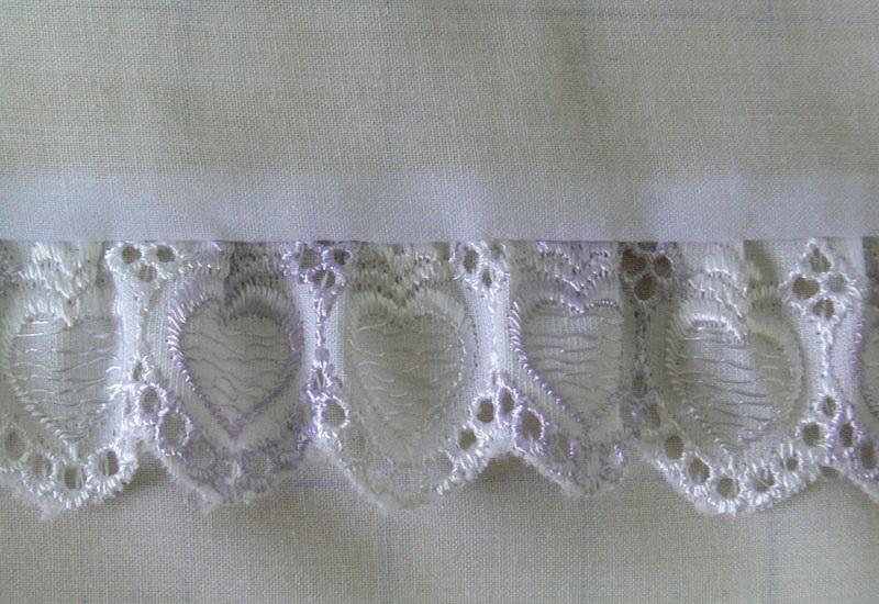 White openwork frills Lacy frills on white fabric