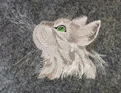 Embroidered curious cat design