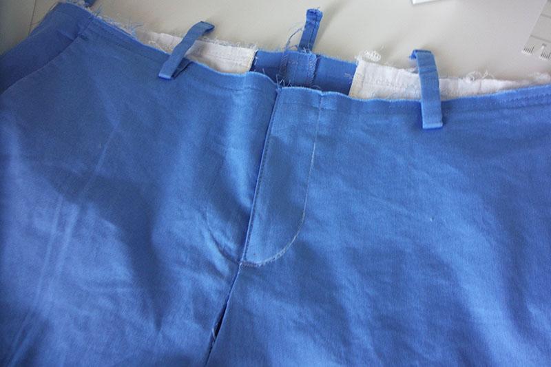 Belt loops on blue shorts