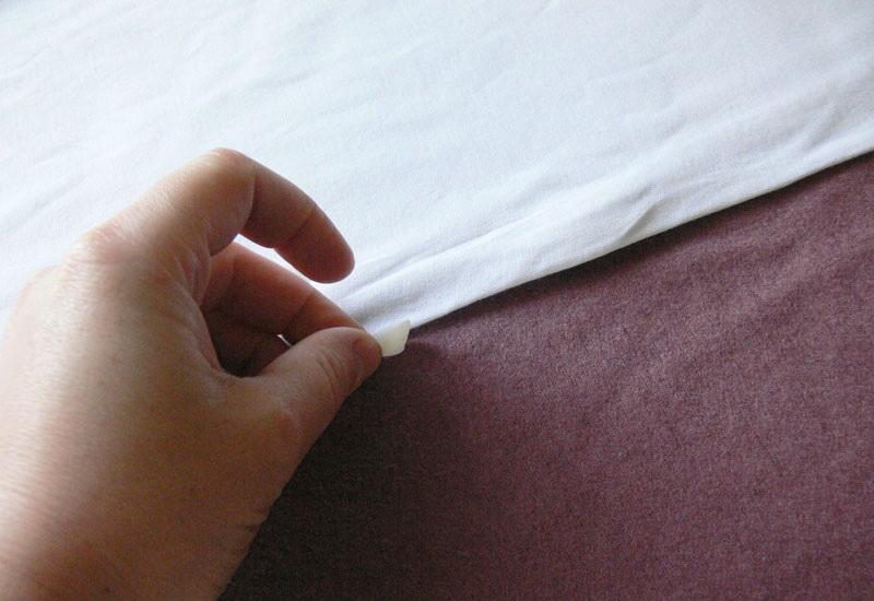 Pinning white T-shirt to lilac knitwear