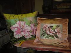 Embroidered cushions with floral motives