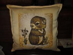 Embroidered pillow with hamster design